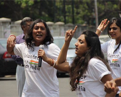 Theatre group Shoonya and Volunteers for a Better India perform a street play outside Bangalore's Town Hall depicting conversations around better voting practices.