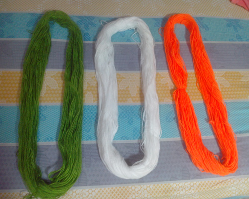 I got orange, white and green wool from the local market